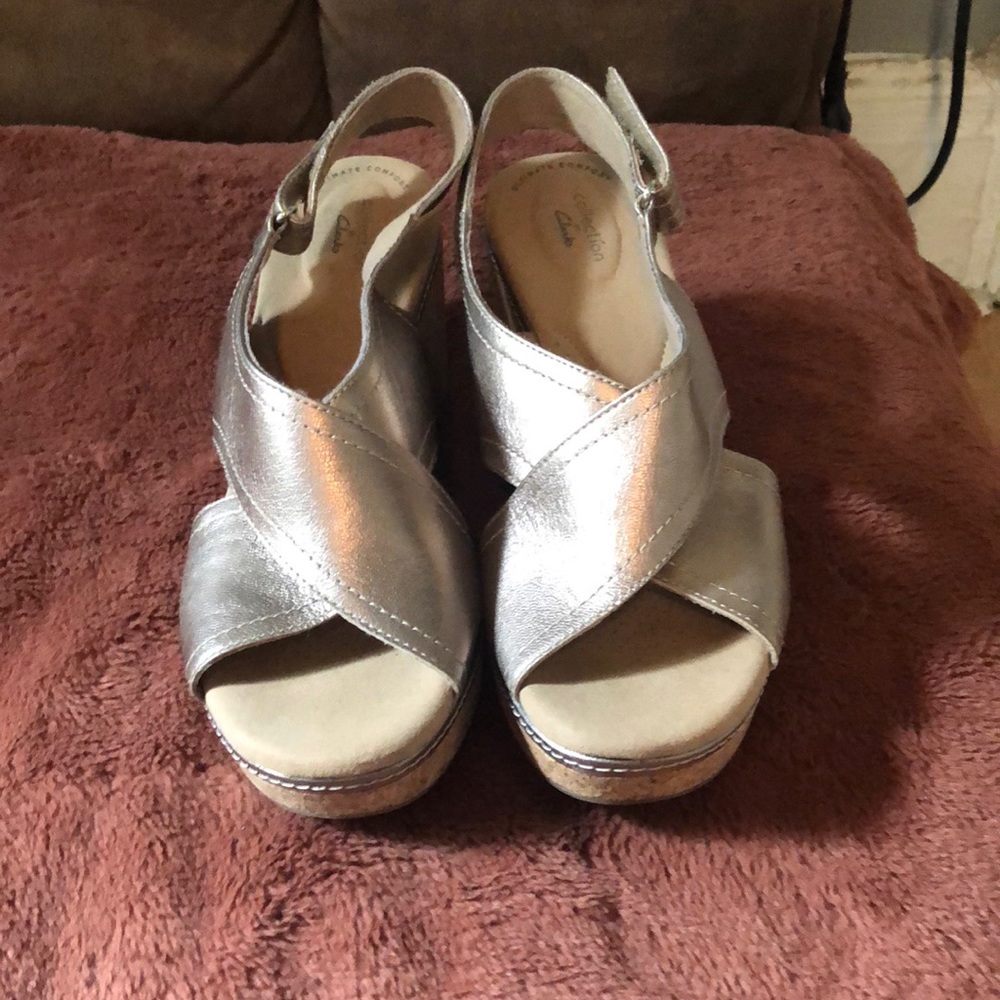 Clarks gold platform sandals size 11 . Never worn outside. Just tried on .
